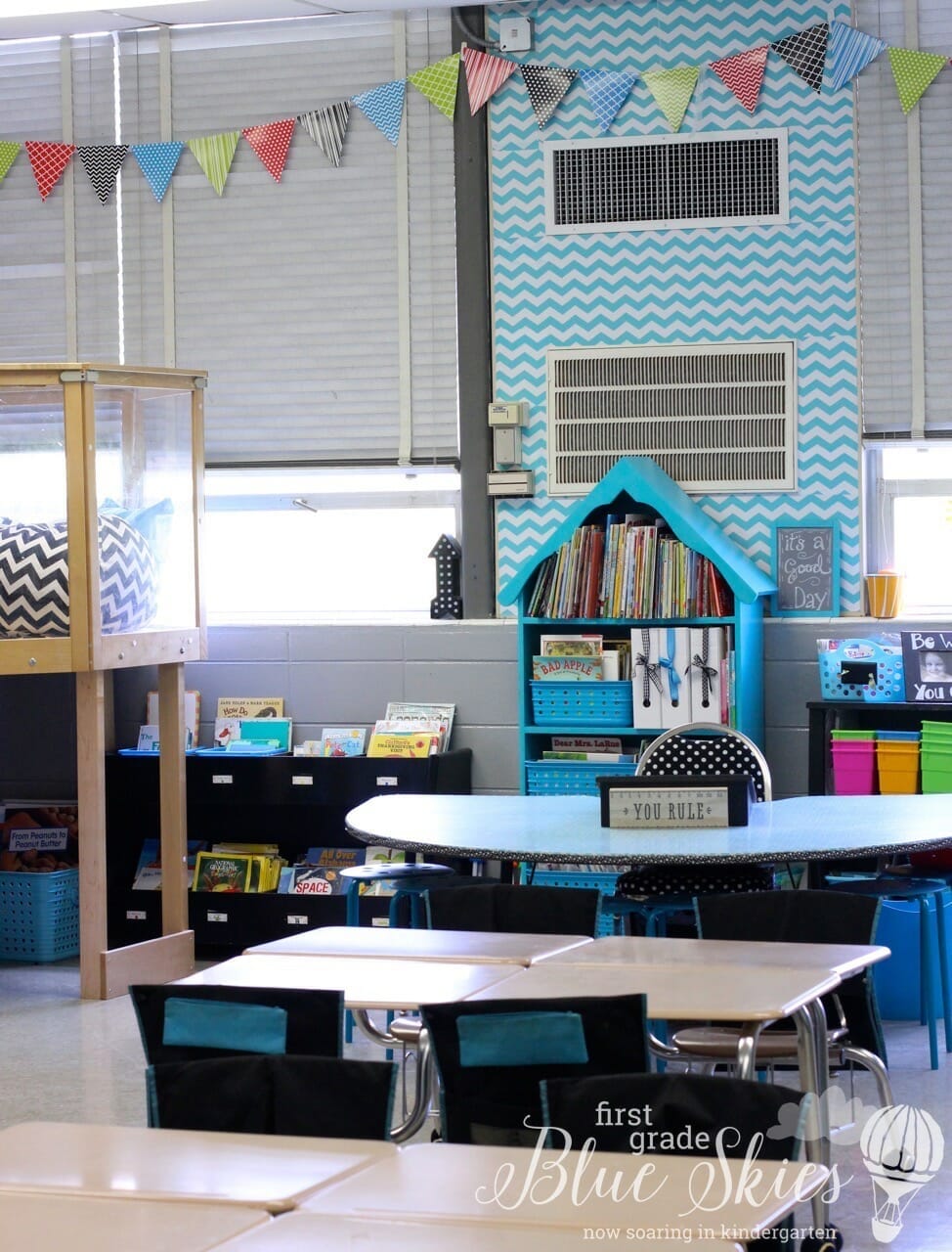 Classroom Reveal 2015 First Grade Blue Skies Banner on Windows and chevron contact paper on table